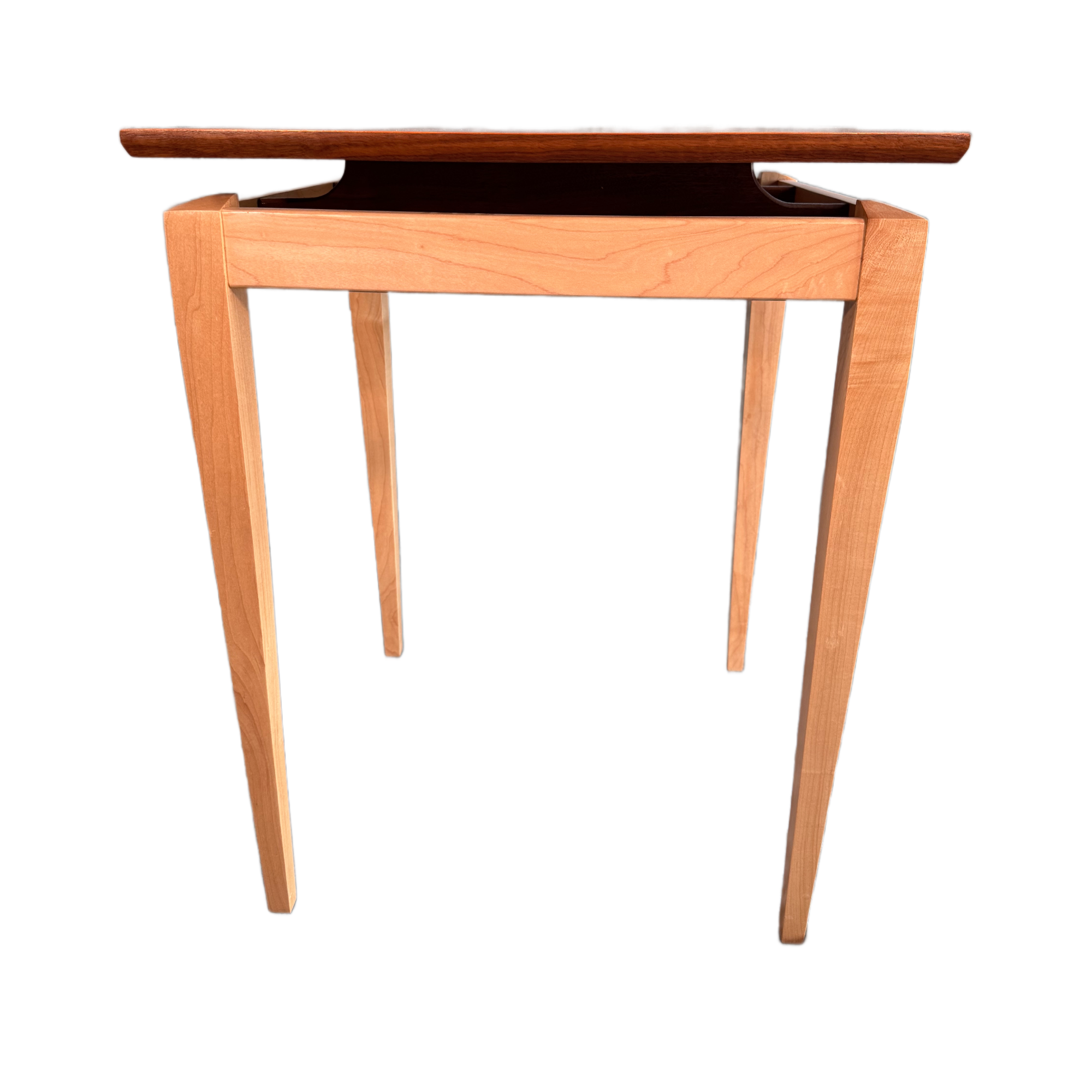 A simple wooden table with four legs and a rectangular top.